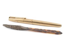 A gold plated Parker fountain pen, with line engraved decoration and 14K nib, 13.5cm long, and a