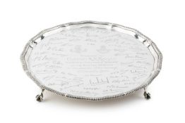 A George VI silver salver, with shaped and gadrooned border, on claw and ball feet, engraved with