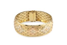A three colour precious metal fancy-link bracelet, designed as an articulated strap of textured