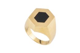 A hardstone signet ring, of slightly elongated hexagonal design, inset with a black hardstone panel,