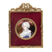 Continental School A Limoges style enamel circular miniature portrait of a lady, with coiffed grey