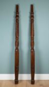 A pair of antique mahogany bedposts