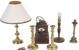 A collection of candlesticks and table lamps