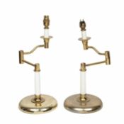 A pair of brass adjustable lamps