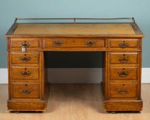 An early 20th century oak pedestal desk