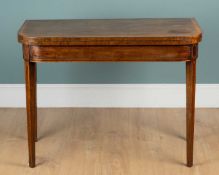 An 19th century mahogany fold-over card table
