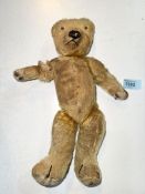 An early 20th century Teddy Bear with growl three 'claws' straw filled