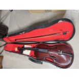 A 19th century three-quarter size violin with bow and hard case.