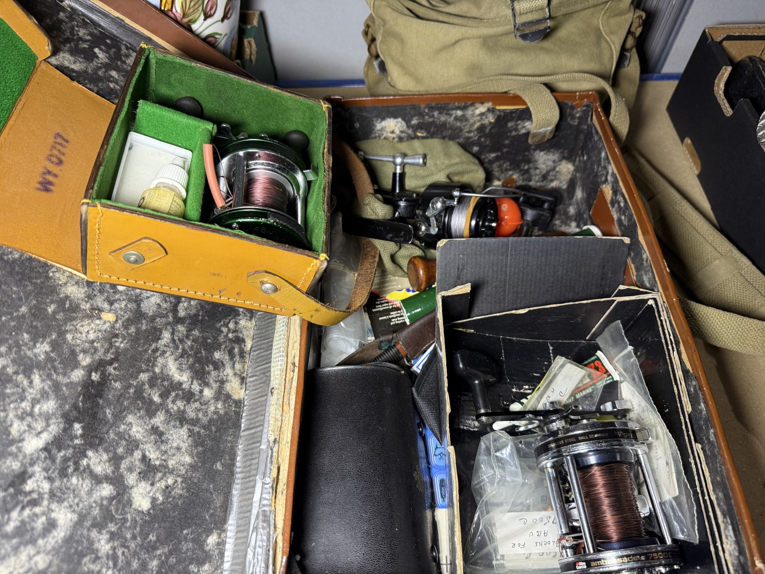 An Ambassadeur fishing reel, other reels and equipment.