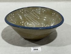 Studio Pottery Earthenware: Slipware bowl white swirls blur rim 'L' makers mark 25cm across.