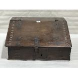 An 18th Century oak chip carved writing box, the sloping fall enclosing a fitted interior. 22'
