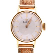 An Omega 18ct gold lady's wristwatch, calibre 483 movement No 17866325, 15mm diam, on 9ct gold