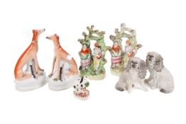 A collection of seven ceramic figures.