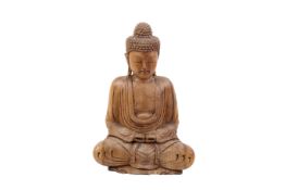 A large carved wooden Chinese Buddha. Modelled in the lotus position.