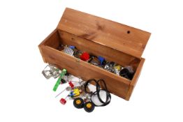 A collection of modern Meccano type pieces in a handmade pine box.