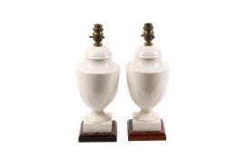 A pair of contemporary cream glazed ceramic table lamps.