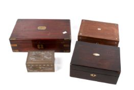 A collection of four assorted wooden boxes.
