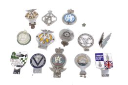 A collection of assorted vintage enamel and other car badges.