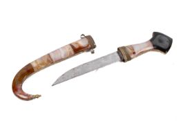 A 20th century middle Eastern 'jambiya' dagger. Having semi-precious stone grip and scabbard.