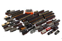 A large collection of 00 gauge model railway kit built wagons and freight rolling stock.