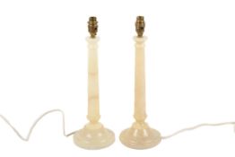 A pair of contemporary Spanish made stone turned table lamps.