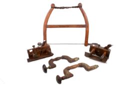 A collection of five antique carpenter's wooden tools.