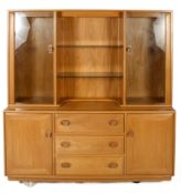 An Ercol two-part cabinet.