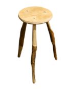 A contemporary wooden stool.
