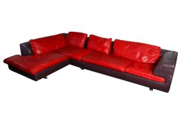 A Roche Bobois purple leather corner sofa.