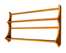 A mid-century Ercol teak wall shelf.