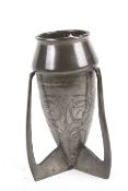 A circa 1903 Archibald Knox (1864-1933) design for Liberty pewter 'rocket bomb' vase. Model 0226.