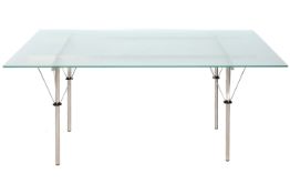 A contemporary design glass top dining table. Having a brush metal base with spoke type supports.