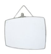 A mid-century rounded rectangular wall mirror. The metal framed crowned with a rams head.