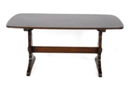 A 1970s rectangular dark Ercol dining table.