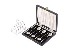 A set of six silver coffee spoons and a toast rack.
