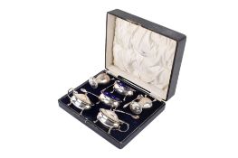 A George V silver Walker & Hall boxed condiment set.