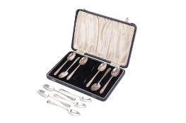 A boxed set of six silver teaspoons and a pair of sugar tongs and a set of five teaspoons.