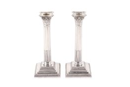 A pair of Victorian weighted silver candlesticks.