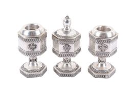 A set of three Jewish silver spice holders.
