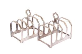 A pair of Elizabeth II silver toast racks. Maker Viner's Ltd (Emile Viner), Sheffield 1963, 105.