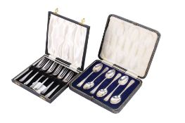 A set of silver teaspoons and a set of silver cake forks.