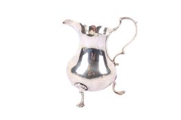 A George III silver milk jug.