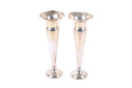 A pair of George V weighted silver tulip vases.