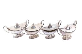 A set of four George III silver sauce tureens and covers.