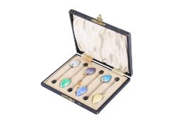 A boxed set of six George V silver and enamel coffee spoons.