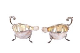 A pair of silver sauceboats.