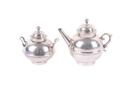 A Victorian matching miniature silver teapot and lidded sugar bowl.
