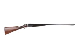 A Cogswell and Harrison side by side 12 gauge shotgun. Box lock action. S/N 45645.