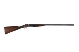 A Webley & Scott double barrel 12 gauge shot gun.