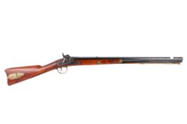 A 204 20 gauge muzzle loading musket. Fore sight missing. loading and patch box in stock, s/n.